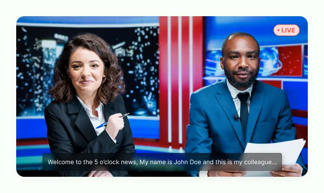 Two anchors at a news desk on a live feed, the opening line of the bulletin captioned across the frame