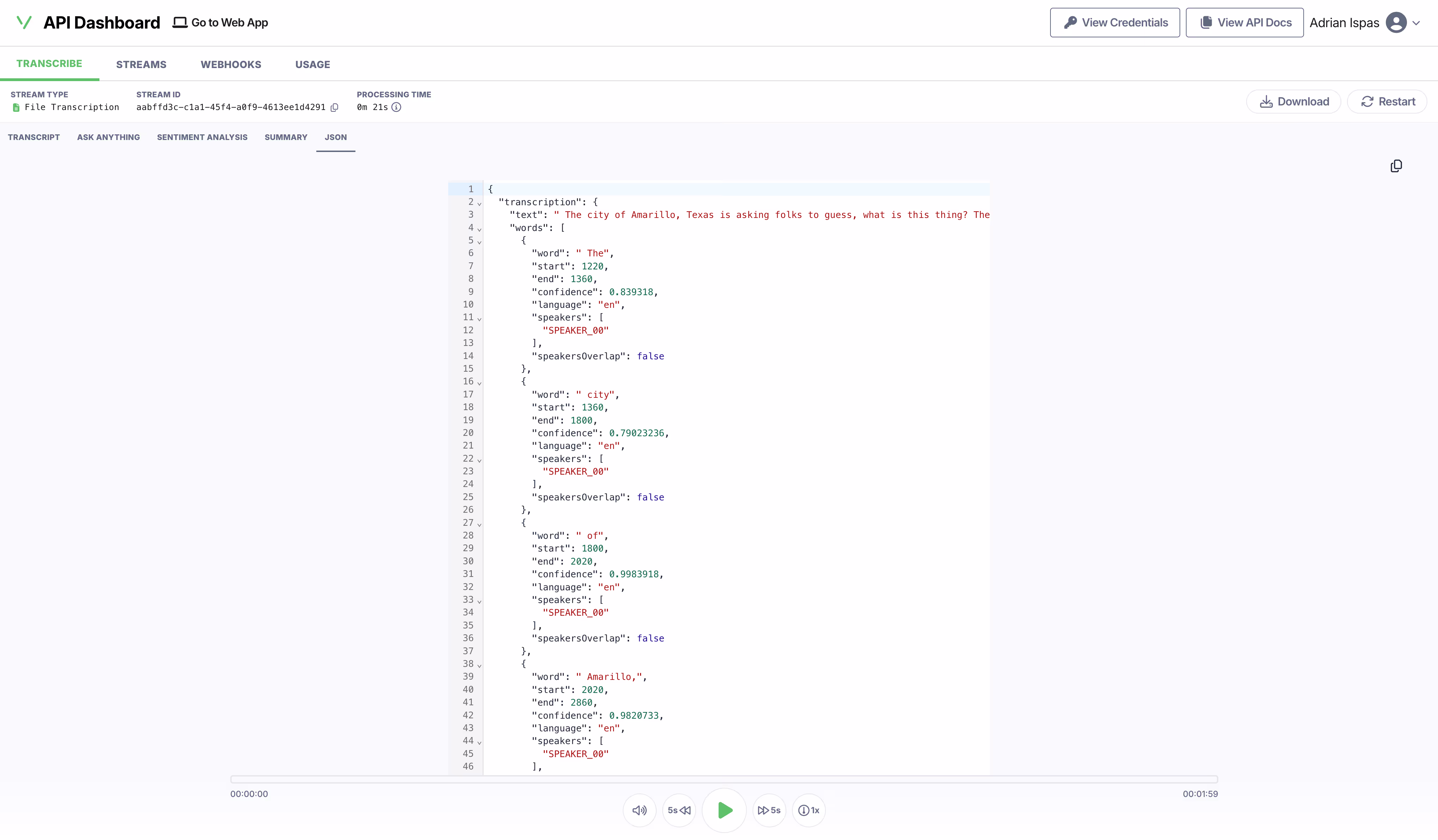The JSON response for a transcription, each word carrying its start and end time, a confidence score, its language and its speaker