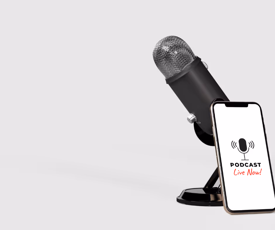 A black studio microphone on a stand beside a phone showing a Podcast Live Now! screen